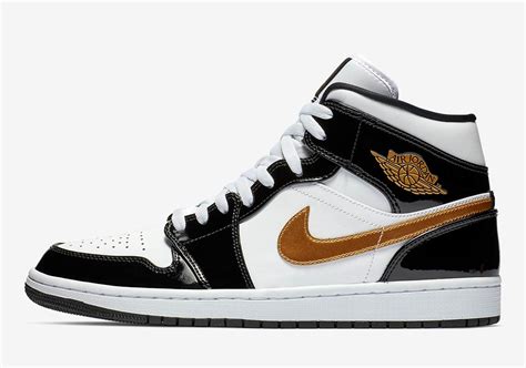 black and gold jordan 1 mids